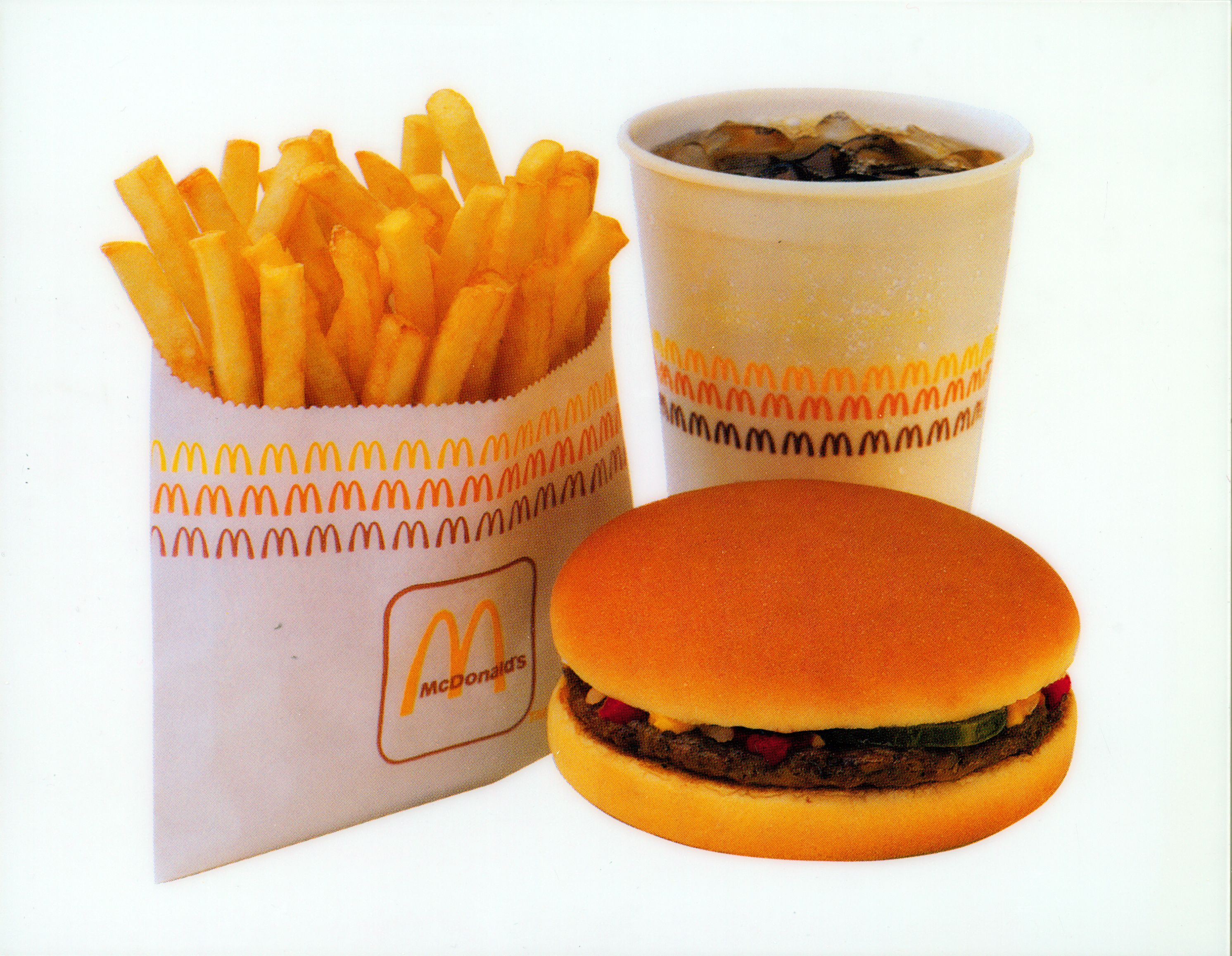 1987 Retro ad featuring the golden arches, McDonald’s World Famous Fries and hamburger
