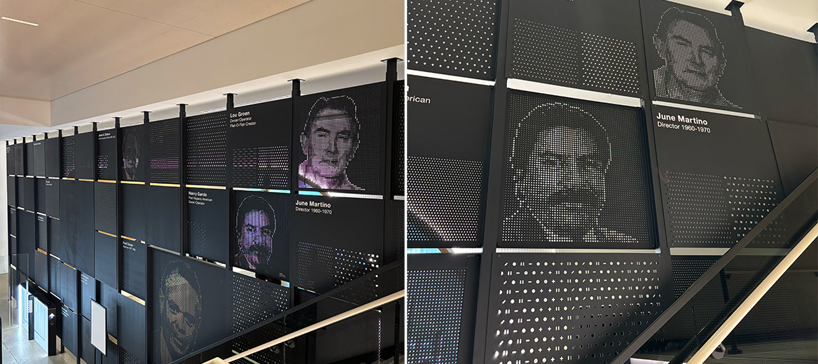 The black, textured wall of notable alumni at McDonald’s Headquarters