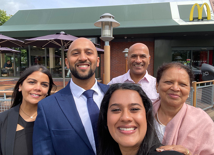 Chiraq and his family in front of McDonald's restaurant