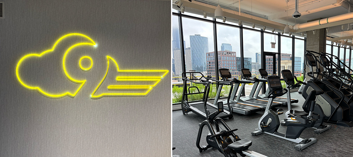 McDonald’s Headquarters Cloud 9 Fitness gym with treadmills, stair machines and rowing machines in front of a window view of Chicago’s West Loop
