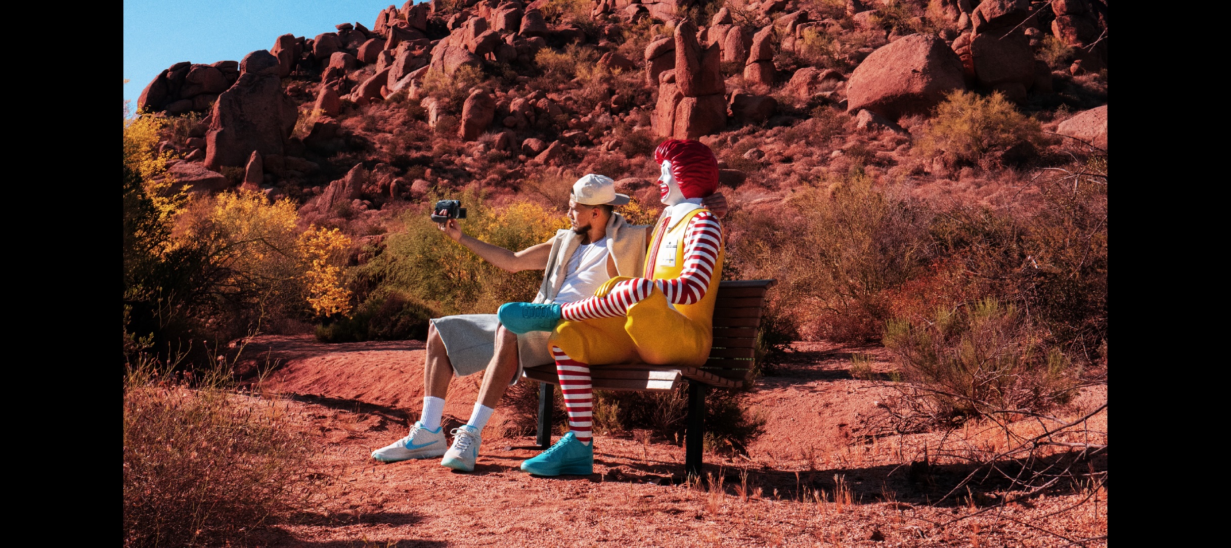 Devin Booker and Ronald taking a selfie in the mountains 