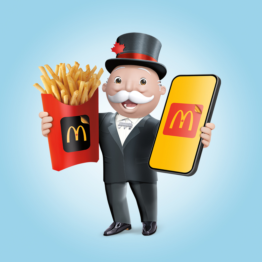 McDonald's Monolopoly Character holding fries and cellphone