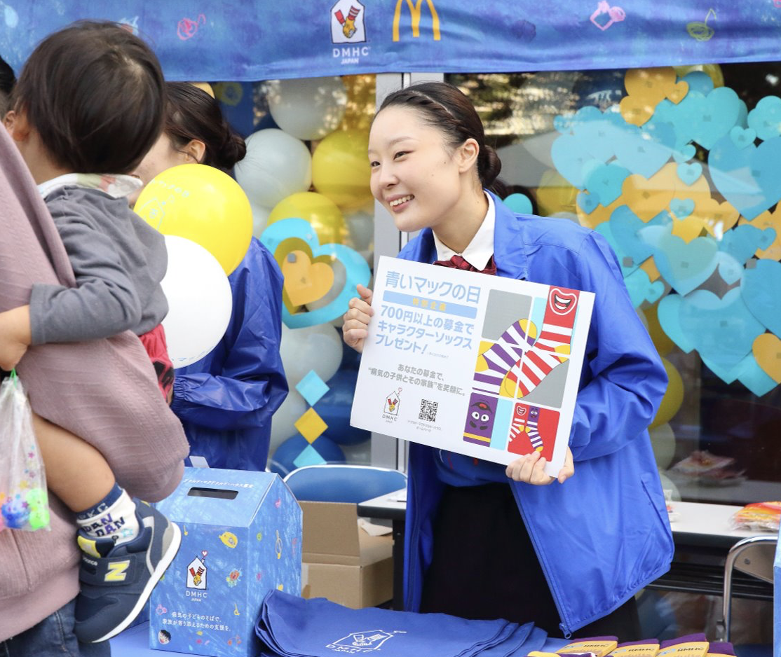 A McDonald’s team member interacts with customers at Japan’s Blue Mac Day A McDonald’s team member interacts with customers at Japan’s Blue Mac Day