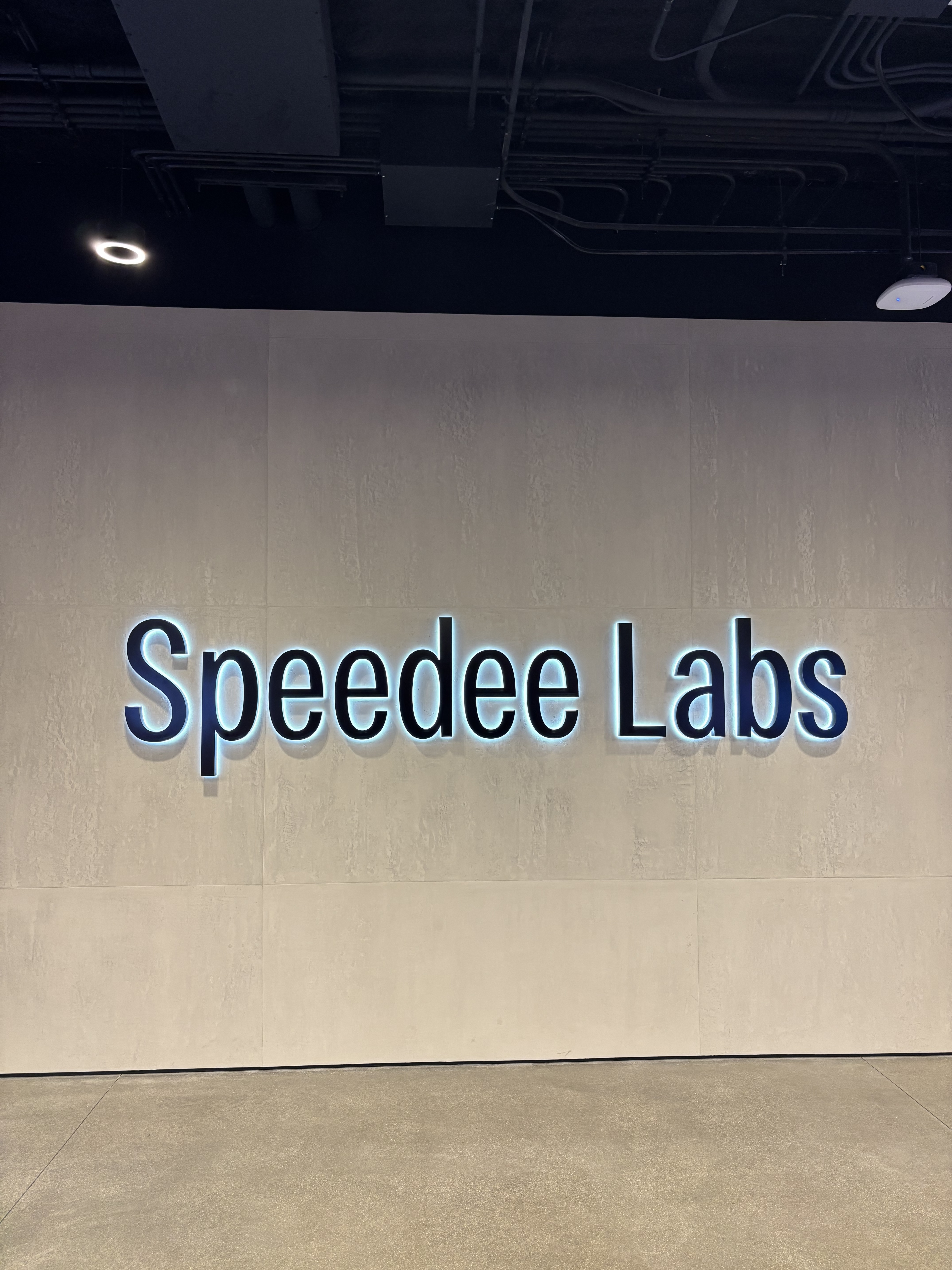 Speedee Labs’ black text logo on the wall at McDonald’s Headquarters