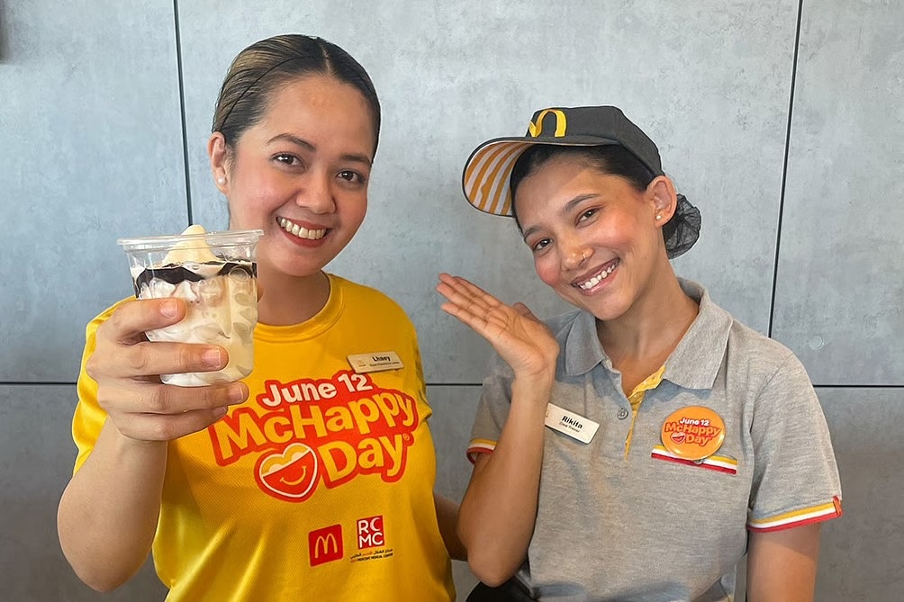 Two McDonald’s team members posing for a photo at a McHappy Day celebration in the United Arab Emirates Two McDonald’s team members posing for a photo at a McHappy Day celebration in the United Arab Emirates
